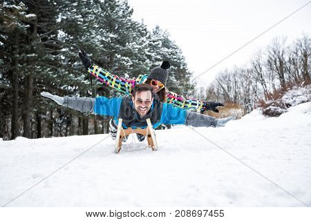Couple Having Fun On Snow Winter Day In Beautiful Mountain