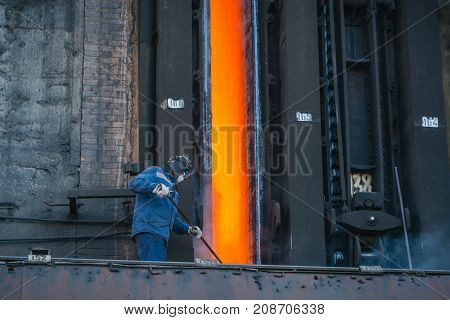 Coke Furnace. Production Of Coke. Steel Works. The Person Loads Coke In The Furnace. The Heated Coal