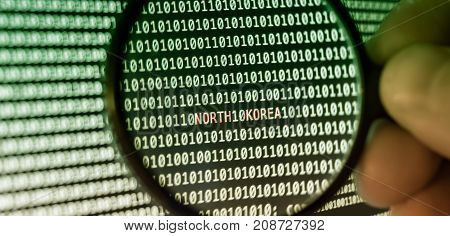Binary code Magnifying glass catches north korea letters