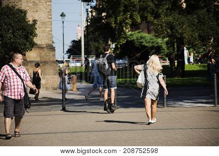 Czechia people walking and use electric unicycling in garden at St. Ludmila at namesti miru or Peace Square on August 29 2017 in Prague Czech Republic