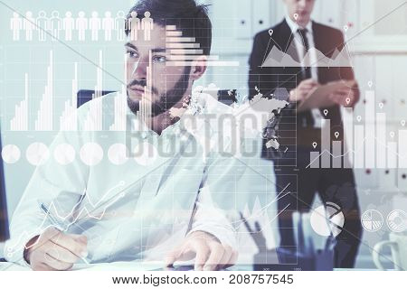 Two young and attractive businessmen working in a white office. Graphs and infographics. Toned image double exposure