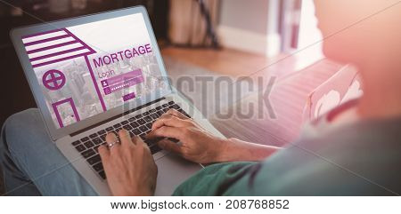 Digital image of cityscape and mortgage text with icon against midsection of man using laptop in living room