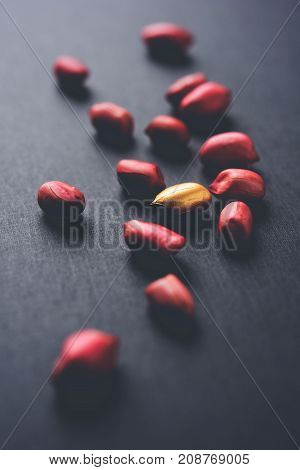 Concept of individuality, luck,value,exclusivity and better choice. Golden peanut or ground nut, standing out amongst normal peanuts, over black or white background
Concept of individuality, luck,value,exclusivity and better choice. Golden peanut or groun