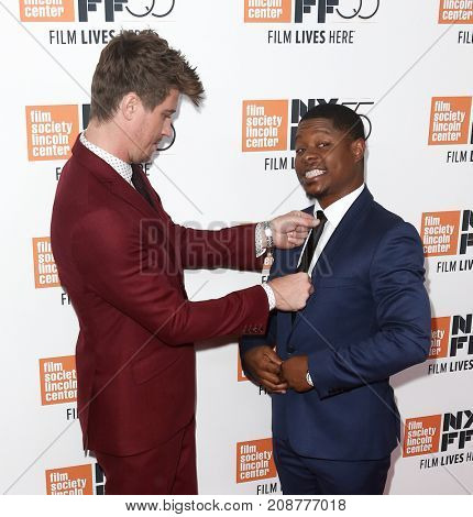 Actors Garrett Hedlund (L) and Jason Mitchell attend the 