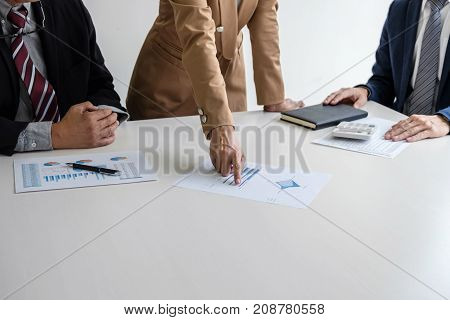Teamwork process Business team managers colleagues discussing and analysis new project investment plan strategy in business profit marketing documents report on table with laptop and tablet.