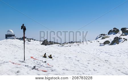 Skiing winter season mountains and ski equipments on ski run