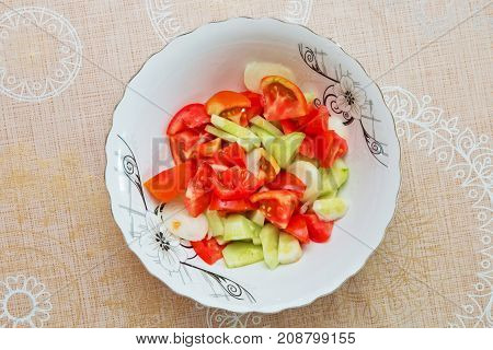 Tomato cucumber salad inside the trough Azerbaijani salad