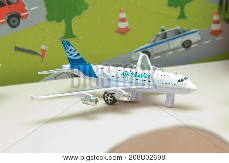 White airplane toys in the background without focus Plastic toy plane on blue copy space background for travel concept