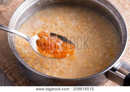 Preparation of tomato soup on the table