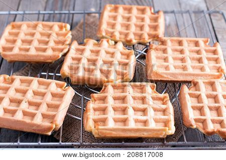 Belgian waffles on grilles on the table