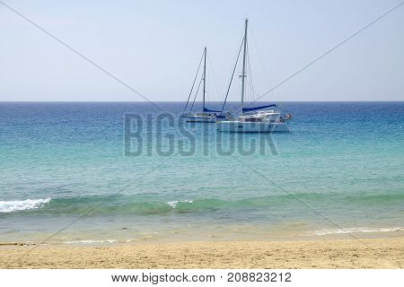 View on white boats in blue ocean.