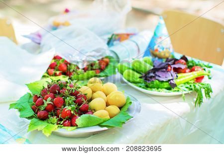 apricots and strawberries in the bowl fruits