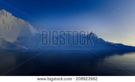 Massive iceberg on arctic ocean in greenland