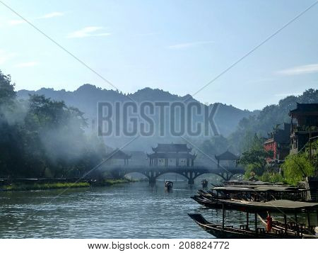 The ancient bridge across the river in the most beautiful ancient town in China - Fenghuang, Phoenix city in Hunan province.