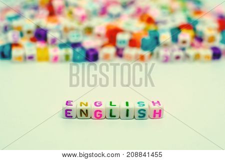 Word "English" from letter beads for learning concept selective focus and added color filter