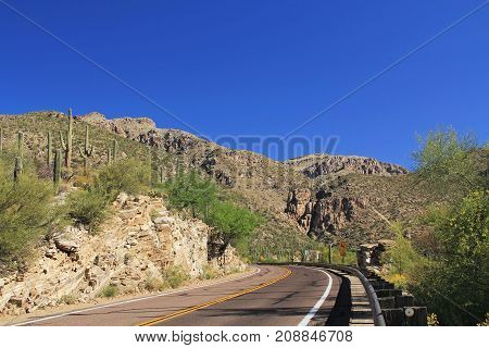 Road leading up Mount Lemmon in Tucson, Arizona, USA in the Santa Catalina Mountains located in the Coronado National Forest with blue sky copy space.