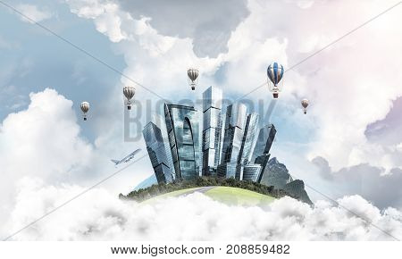 Green flying island among clouds with urban view of towers and skyscrapers. Flying aerostates and blue cloudy skyscape on background. 3D rendering.