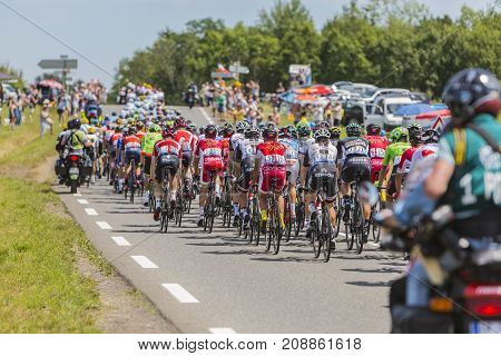 Mailleroncourt-Saint-Pancras France - July 5 2017: The rear view of the peloton riding on a road to La Planche des Belle Filles during the stage 5 of Tour de France 2017.