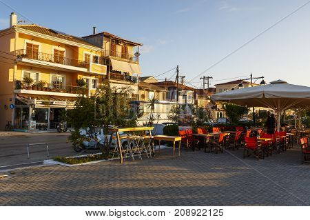 NYDRI, GREECE - OCTOBER 2, 2017: Coffee shop at the seafront of Lefkada harbour in Greece on October 2, 2017.