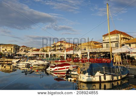 NYDRI, GREECE - OCTOBER 2, 2017: Coffee shops and restaurants in the harbour of Lefkada town, Greece on October 2, 2017.