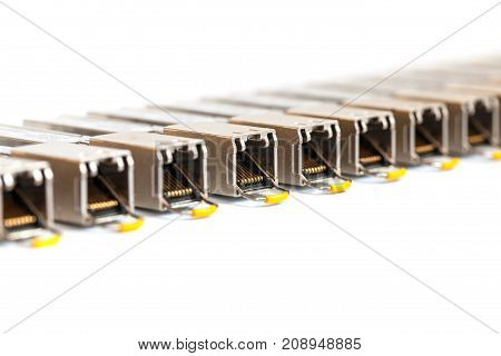 Row of Internet SFP (Small Form-factor Pluggable) network modules for network switch. Close up. Isolated.