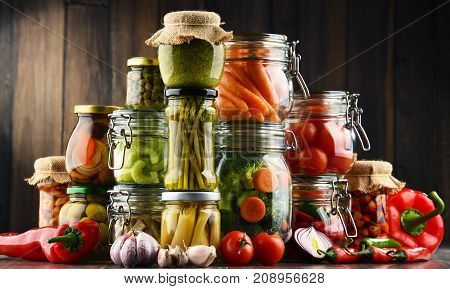 Jars With Marinated Food And Organic Raw Vegetables