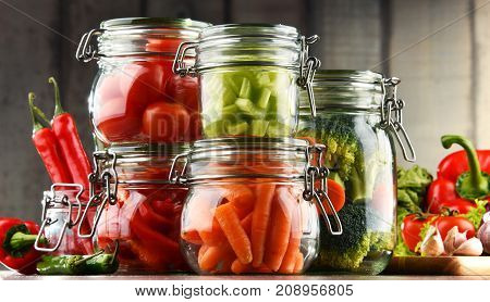 Jars With Marinated Food And Organic Raw Vegetables