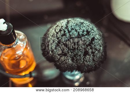 The Tools Of A Barber On The Desktop In Front Of The Mirror