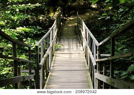 wooden bridge over the ditch on the route in the canyon of the Chertovy Gates, Krasnodar Territory