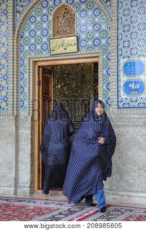 Fars Province Shiraz Iran - 19 april 2017: Shah Cheragh Shrine Muslim women in veils entering into and exiting out of the mosque.