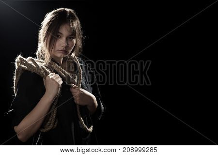 woman executioner with wrap on black background