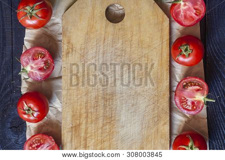 Salad Ingredients. Fresh Raw Vegetables On Wood. Cutting Board With A Kitchen Knife. Group Of Omatoe