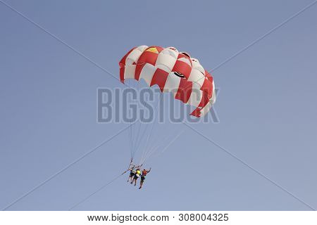 Paraglider With A Saddle For People. Parasales - Water Parachutes. Bright Colours.