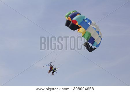 Paraglider With A Saddle For People. Parasales - Water Parachutes. Bright Colours.