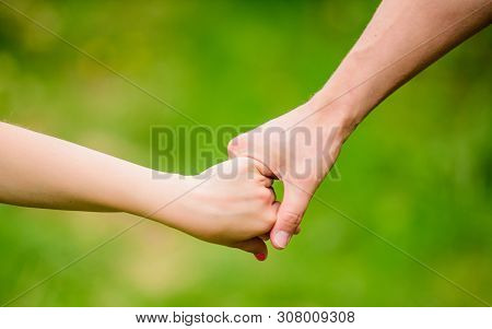 Help And Support. Father Hold His Child With Hand. Hands Together. Family Values And Love. Family Bo