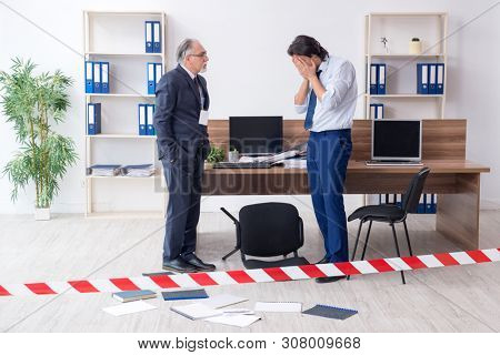 Forensic investigator investigating theft in the office