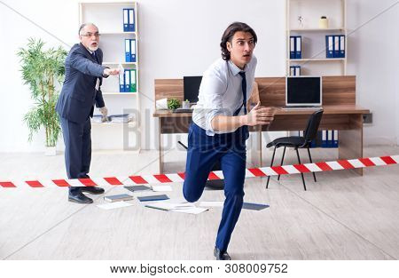 Forensic investigator investigating theft in the office
