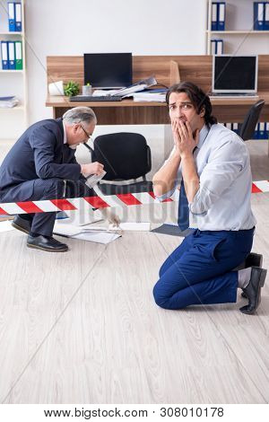 Forensic investigator investigating theft in the office