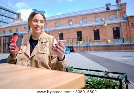 woman using smartphone in caffee shop. smart phone or mobile 