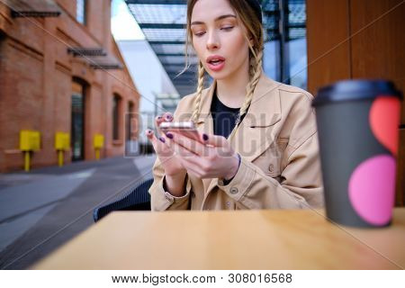 woman using smartphone in caffee shop. smart phone or mobile 
