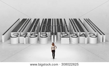 Young businessman standing in front of a big codebar