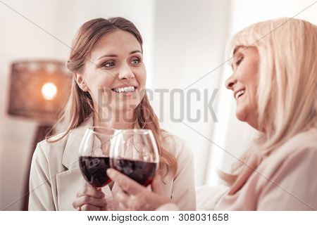 Elegant Elderly Babyboomer Saying A Toast To Her Daughter