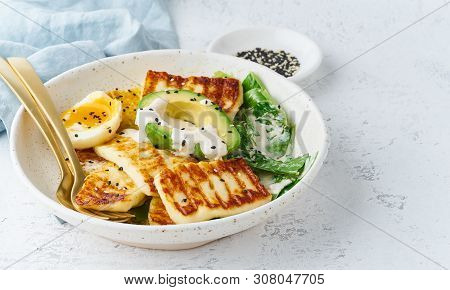 Keto Ketogenic Diet Soft Boiled Eggs With Grilled Haloumi, Avocado And Lettuce, Mediterranean Cuisin