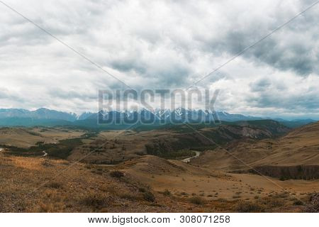 Summer in Kurai steppe and North-Chui ridge of Altai mountains, Russia. Cloud day.