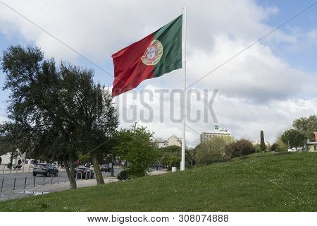 Lisbon, Portugal. April 2018.  The Portuguese Flag Waving In Parque Edoardo Vii