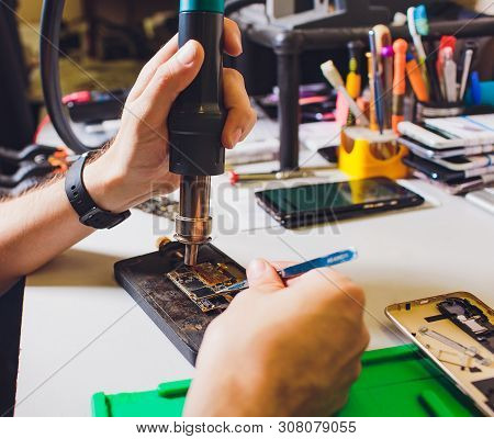 Cell Phone Repair. Smartphone Parts And Tools For Recovery, Selective Focus. Drying Equipment