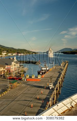 Sept 17, 2018 - Ketchikan, Ak: Docks And Departing Southbound Cruise Ship At Sunset.