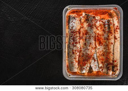 Marinated Fillet Mackerel Or Fillet Herring Fish With Spices Packed In Box On Slate Stone Background