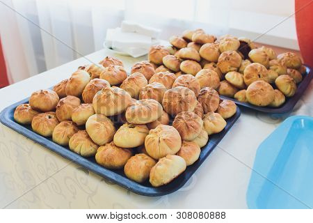 Preparation Of Belyashes. Traditional Russian Meat Pies Belyashi. Belyashes On A Table. Russian, Bas