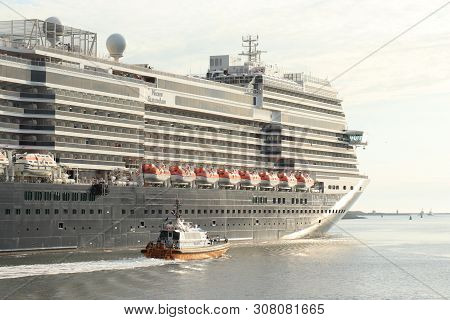 Ijmuiden, The Netherlands -june, 9th 2019: Nieuw Statendam Leaving Ijmuiden Sea Lock, Joined By Pilo